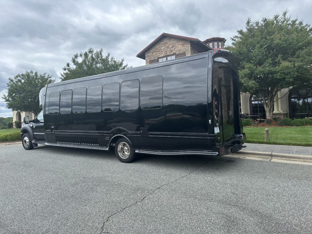 Black 26 passenger party Bus