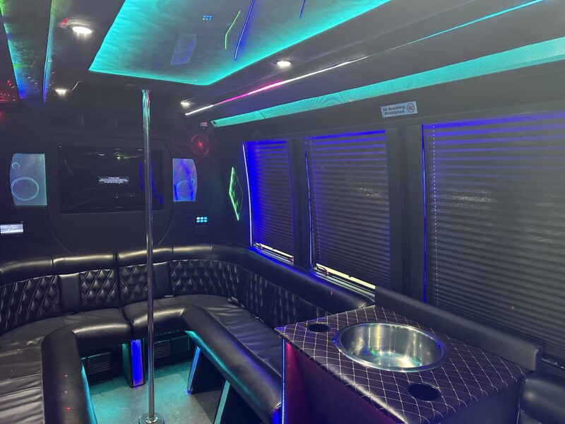Black 14 passenger Sprinter Van