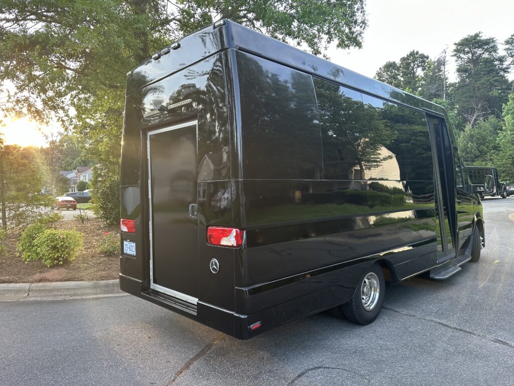 Black 14 passenger Sprinter Van